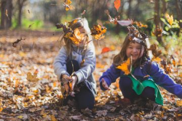 Children playing in the leaves - celebrating child health day